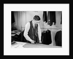Tailor Cutting Fabric by Anonymous