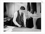 Tailor Cutting Fabric by Anonymous
