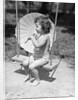 Girl on Swing Holding Parasol by Anonymous