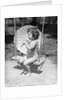 Girl on Swing Holding Parasol by Anonymous