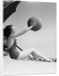 Young Woman Playing With Beach Ball by Anonymous