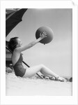 Young Woman Playing With Beach Ball by Anonymous