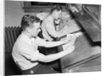 Men At Desks Proofreading Documents by Anonymous