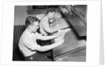 Men At Desks Proofreading Documents by Anonymous