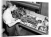 Man Working with Lathe in Basement Workshop by Anonymous