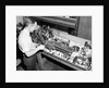 Man Working with Lathe in Basement Workshop by Anonymous