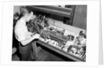 Man Working with Lathe in Basement Workshop by Anonymous
