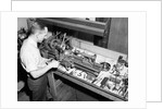 Man Working with Lathe in Basement Workshop by Anonymous