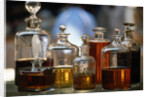 Display Of Perfume Bottles In Market by Anonymous