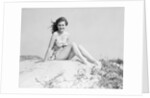 Young Woman Seated on Sand Dune by Anonymous