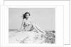 Young Woman Seated on Sand Dune by Anonymous