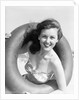 Woman with Head Through Inner Tube by Anonymous