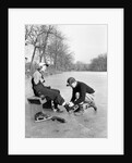 Man Putting on Woman's Ice Skates by Anonymous