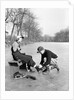 Man Putting on Woman's Ice Skates by Anonymous
