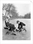 Man Putting on Woman's Ice Skates by Anonymous