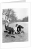 Man Putting on Woman's Ice Skates by Anonymous
