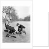 Man Putting on Woman's Ice Skates by Anonymous