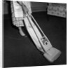 Woman Vacuuming by Anonymous