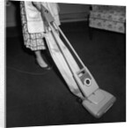 Woman Vacuuming by Anonymous