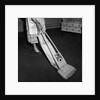 Woman Vacuuming by Anonymous
