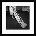 Woman Vacuuming by Anonymous