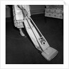 Woman Vacuuming by Anonymous