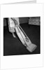 Woman Vacuuming by Anonymous