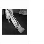 Woman Vacuuming by Anonymous