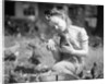 Woman Holds Chicken For Feeding by Anonymous
