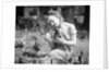 Woman Holds Chicken For Feeding by Anonymous