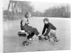 Man Lacing a Woman's Ice Skate by Anonymous