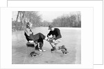 Man Putting on Woman's Ice Skates by Anonymous
