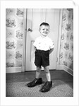 Boy Wearing Men's Shoes by Anonymous