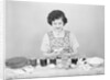 Woman Coloring Easter Eggs by Anonymous