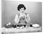 Woman Coloring Easter Eggs with a Paintbrush by Anonymous