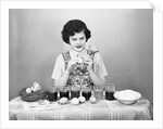 Woman Coloring Easter Eggs with a Paintbrush by Anonymous