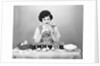 Woman Coloring Easter Eggs with a Paintbrush by Anonymous