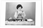 Woman Coloring Easter Eggs with a Paintbrush by Anonymous