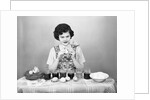 Woman Coloring Easter Eggs with a Paintbrush by Anonymous