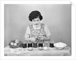 Girl Coloring Easter Eggs by Corbis