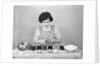 Girl Coloring Easter Eggs by Anonymous