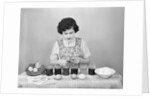 Girl Coloring Easter Eggs by Anonymous