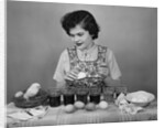 Girl Coloring Easter Eggs by Anonymous