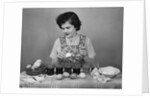 Girl Coloring Easter Eggs by Anonymous