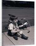 Boy Fallen Off Tricycle and Holding Knee by Anonymous