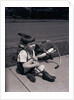 Boy Fallen Off Tricycle and Holding Knee by Anonymous