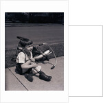 Boy Fallen Off Tricycle and Holding Knee by Anonymous
