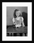 Girl Putting Money In Piggy Bank by Anonymous