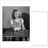 Girl Putting Money In Piggy Bank by Anonymous