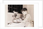 Boy Washing Dishes by Anonymous